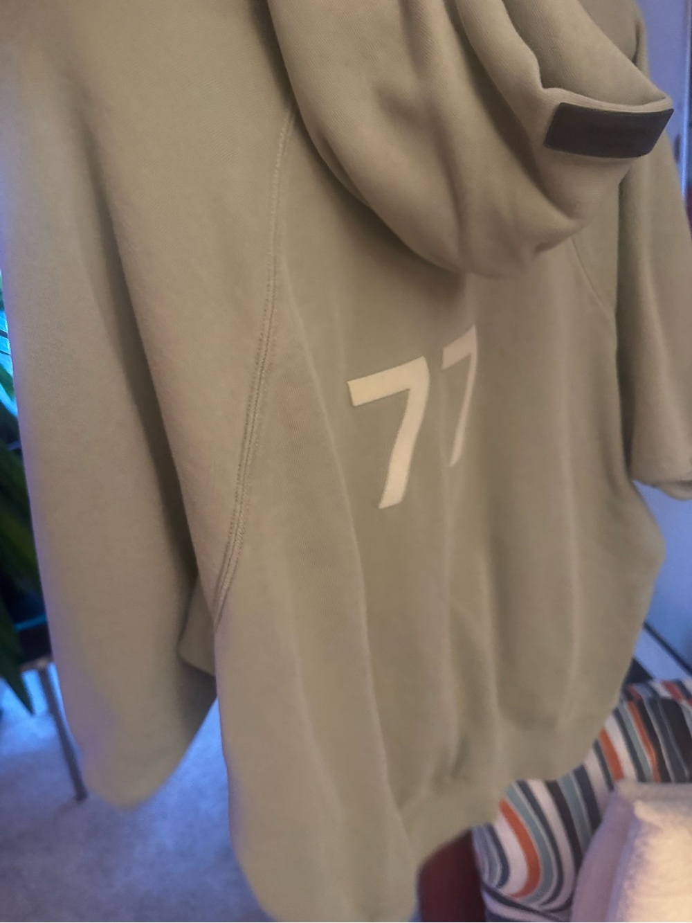Essentials Sage Green Hoodie with White '77' Back Graphic